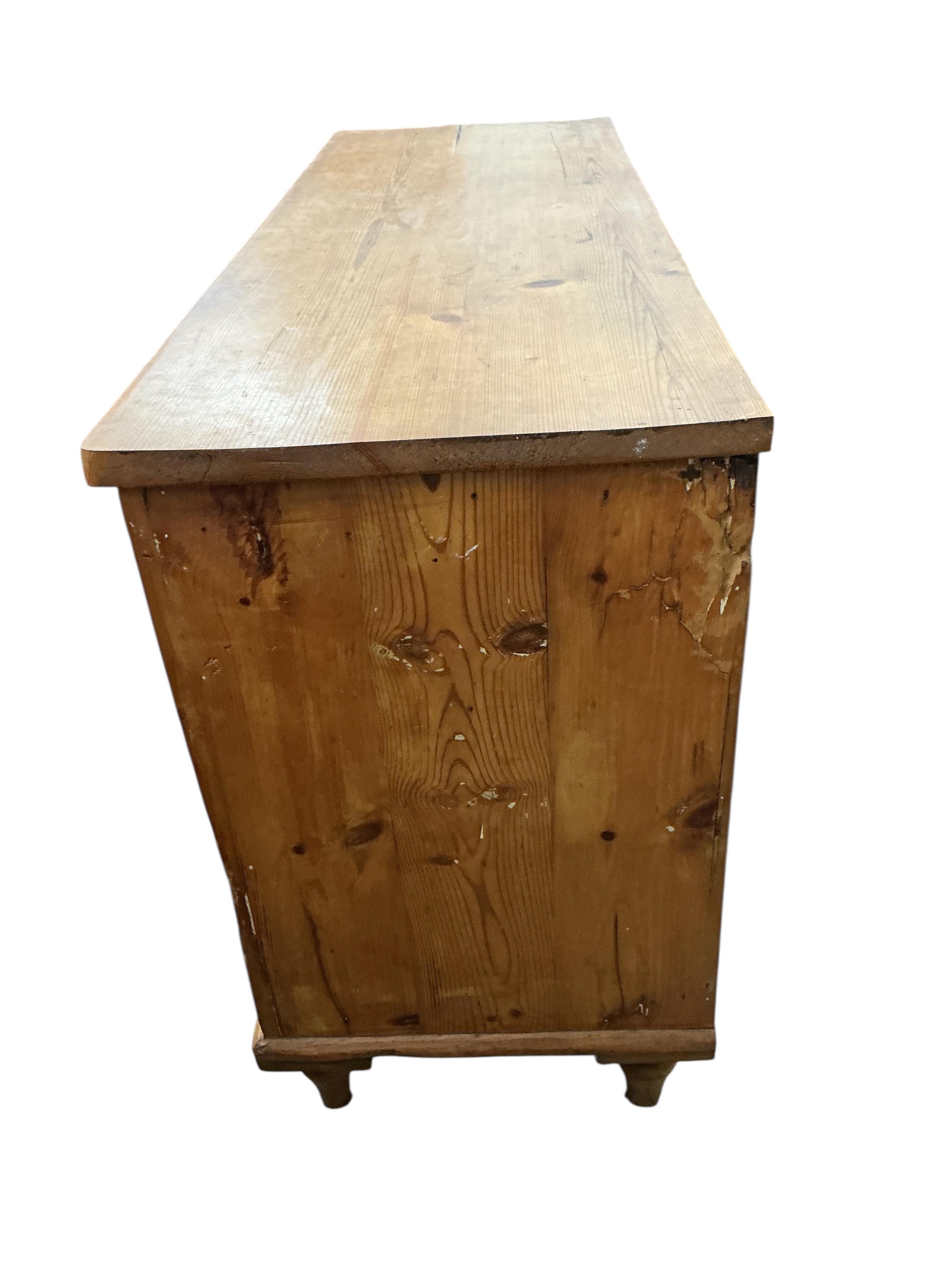 A late Victorian pine six drawer low dresser, width 132cm, depth 47cm, height 82cm